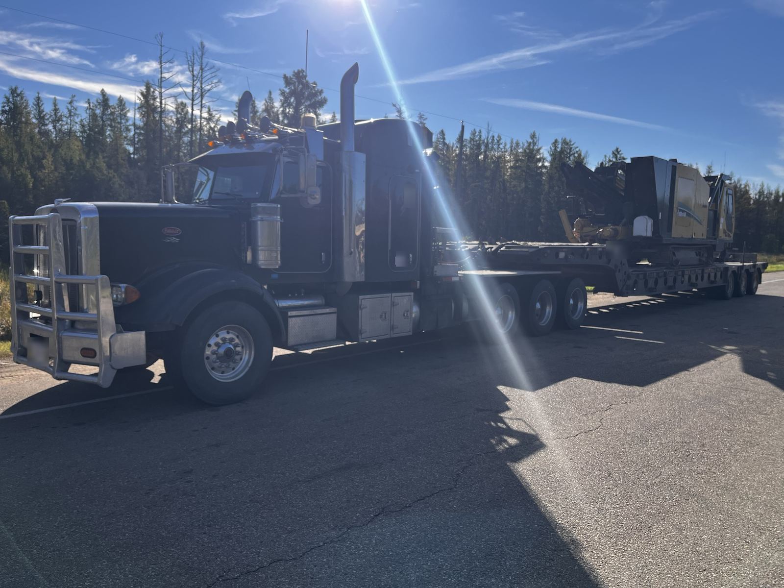 Vermeer D100x140 loaded on a lowboy, mobilizing to site